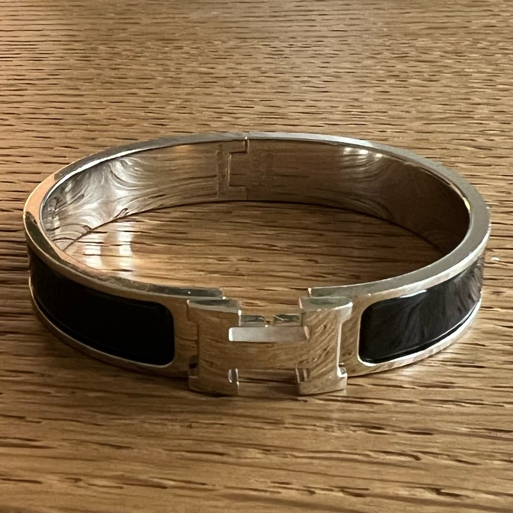 Hermes Silver Toned Black Ceramic Clic Clac Bracelet. 'H' closure.